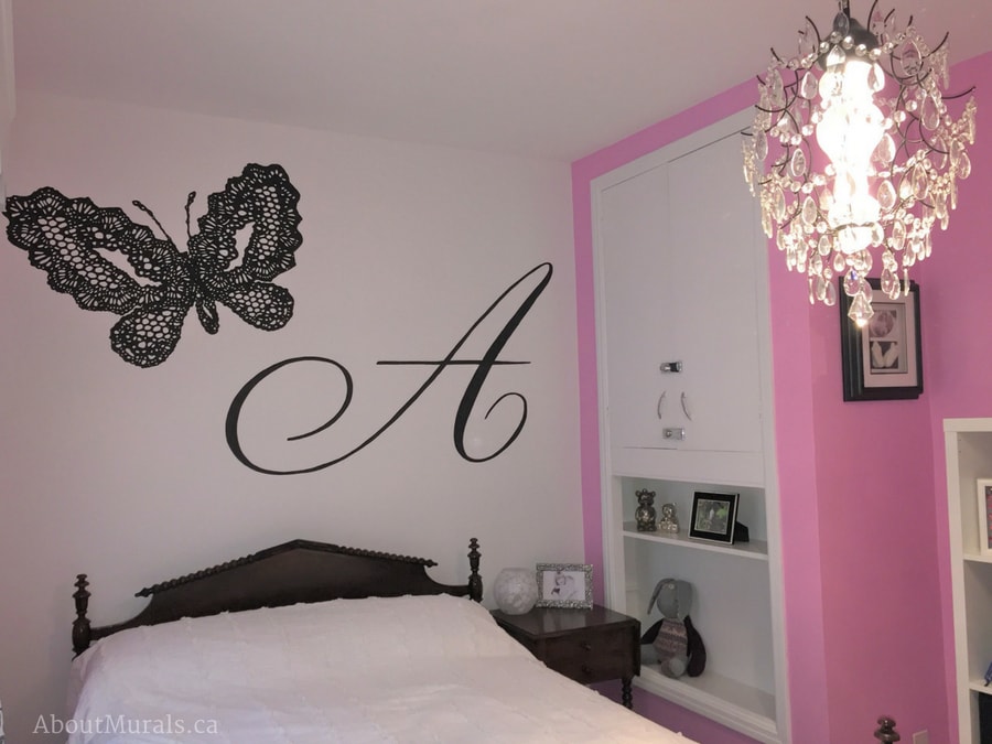 A black butterfly mural featuring a lacy butterfly and initial letter A for Audrey, painted by Adrienne of AboutMurals.ca