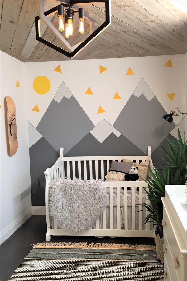 A grey mountain mural in a baby nursery painted by AboutMurals.ca