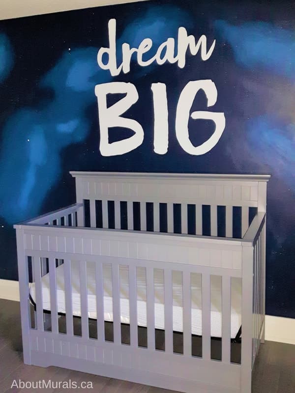 A dream big mural painted on an outer space background by muralist Adrienne of AboutMurals.ca