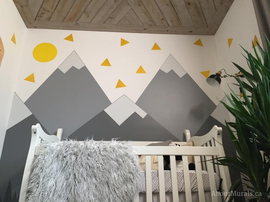 A grey mountain mural painted by Adrienne of AboutMurals.ca for Holmes Next Generation TV show in a baby nursery