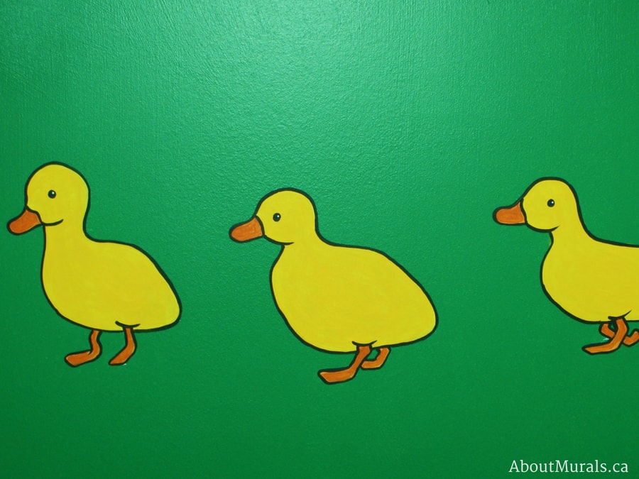 Adrienne of AboutMurals.ca painted yellow baby ducks on a playroom wall