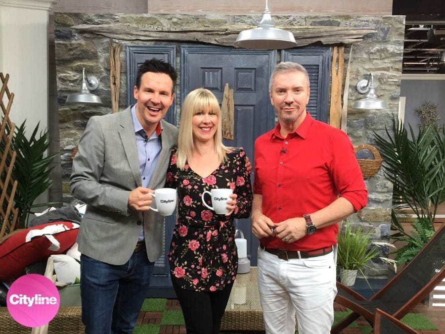 A gray stone wallpaper is used on Cityline by Colin & Justin to create coastal rustic interiors - About Murals