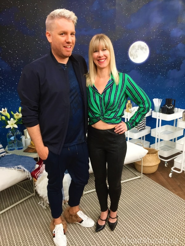 Night Sky Mural, as seen on Christian Dare's Cityline wall, features a soft white moon in a navy blue sky surrounded by thousands of twinkling stars. Star wallpaper sold by AboutMurals.ca.