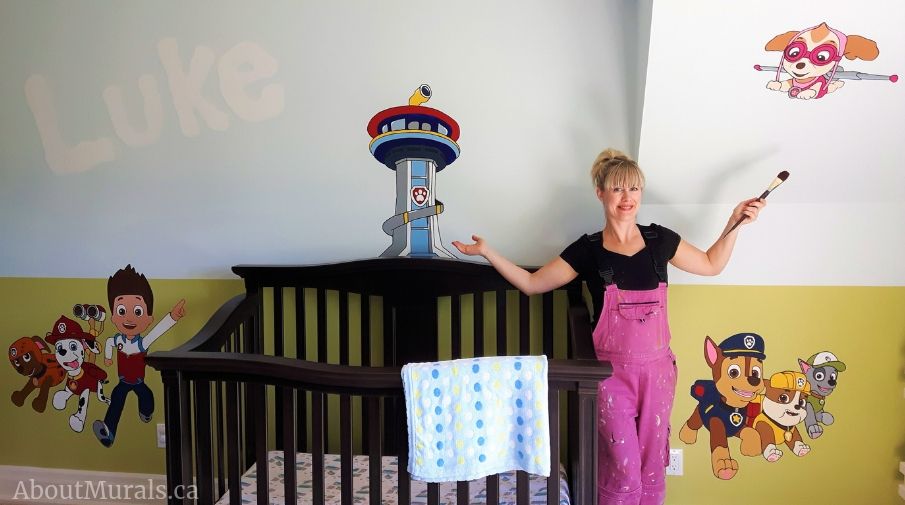 Adrienne Scanlan with her hand-painted Paw Patrol Mural.