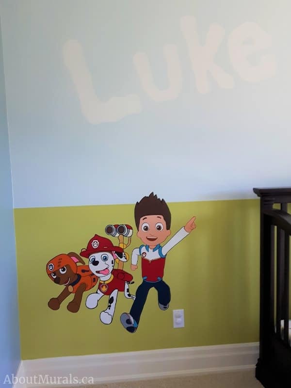 A paw patrol mural featuring Ryder, Marshall and Zuma, painted by Adrienne of AboutMurals.ca