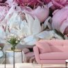 Peony Wallpaper, as seen on the wall of this living room, features a closeup of these beautiful pink florals. Flower wall murals sold by AboutMurals.ca.