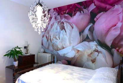Peony Wallpaper, as seen on the wall of this bedroom, is a high resolution photo mural of large pink peony flowers with textured petals from About Murals.