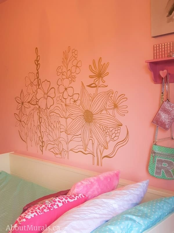 A wildflower mural painted by Adrienne of AboutMurals.ca in a shimmery gold paint