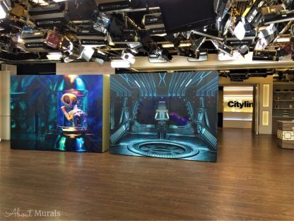 Extraterrestrial Wallpaper, as seen on the wall of this TV set for Cityline, is a Halloween wall mural with an alien floating in a jar from About Murals.