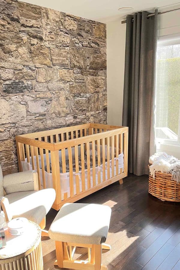 Castle Stone Wallpaper, as seen on the wall of this nursery, is a high resolution photo wall mural of a real stone wall with hints of brown and beige from About Murals.