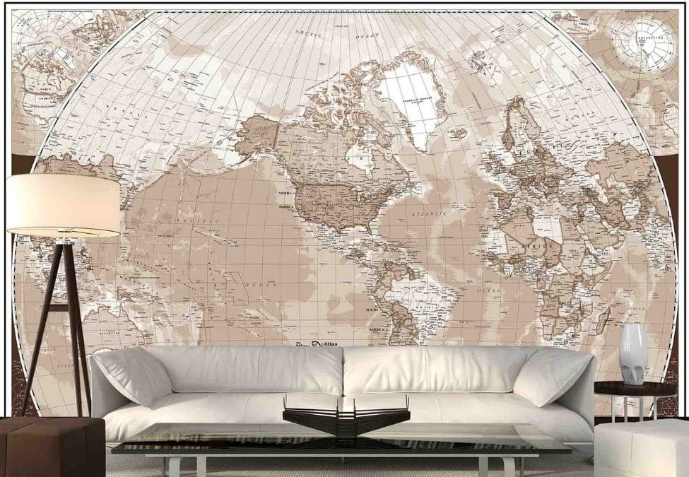 Sepia World Map Wallpaper, as seen on the wall of this living room, features a brown, atlas style design with all continent, country, state and city names from About Murals.
