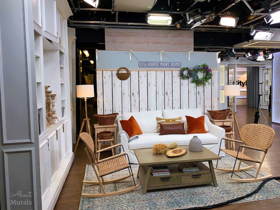 White Wood Wallpaper, as seen on the set wall at Cityline, features a whitewashed timber look from About Murals.