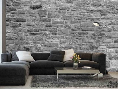Grey Stone Wallpaper, as seen on the wall of this living room, features a textured, 3D looking stacked stone wall. Stone wall murals sold by AboutMurals.ca.
