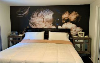 Black Floral Wallpaper, as seen on the wall of this bedroom, features roses and peonies on a dark background. Flower wallpaper sold by AboutMurals.ca.