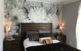 Black and White Flower Wallpaper, as seen on the wall of this bedroom, creates a beautiful accent wall with its grey dahlia flowers. Floral wallpaper from AboutMurals.ca.
