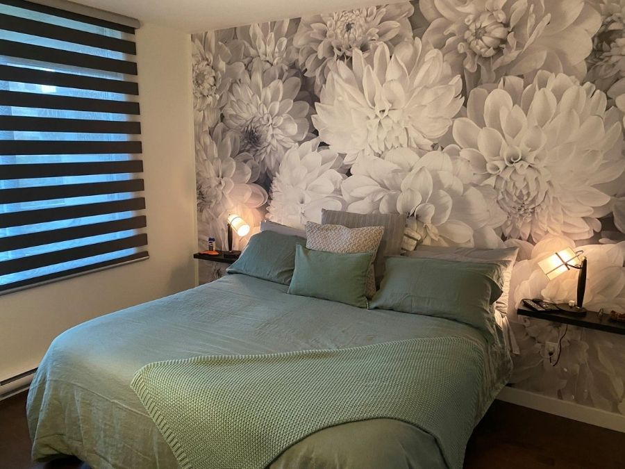 Black and White Flower Wallpaper, as seen on the wall of this grey bedroom, features large dahlia flowers from About Murals.