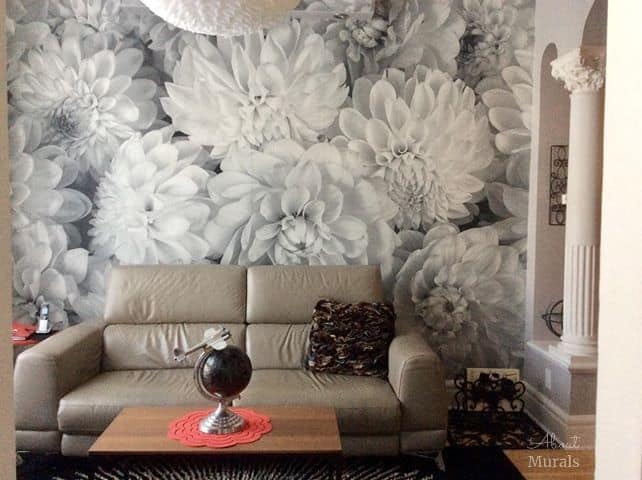 Black and White Flower Wallpaper, as seen on the wall of this living room, creates a beautiful accent wall with its gray dahlia flowers. Floral wallpaper from AboutMurals.ca.