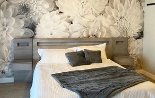 Black and White Flower Wallpaper, as seen on the wall of this monochrome bedroom, is a photo mural of large black and white dahlias from About Murals.