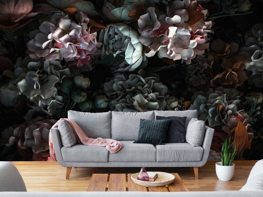 Dark Floral Wallpaper, as seen in this grey living room, features peony and hydrangea flowers made in fabric against a black background from About Murals.