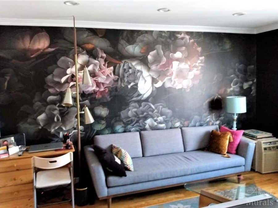 Dark Floral Wallpaper, as seen on the wall of this living room, features pink and white fabric flowers on a black background. Flower wallpaper sold by AboutMurals.ca.