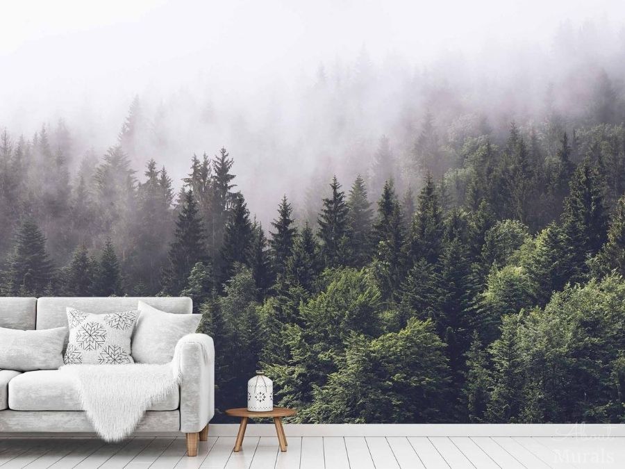 Foggy Forest Wallpaper, as seen on the wall of this living room, features a grey misty fog settling over dark pine trees. Pine tree wallpaper sold by AboutMurals.ca.