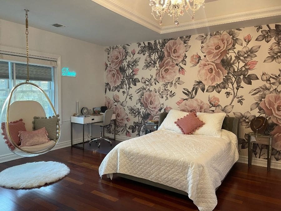 Vintage Flower Wallpaper, as seen on the wall of this bedroom, is a floral mural with antique roses in pink and grey from About Murals.