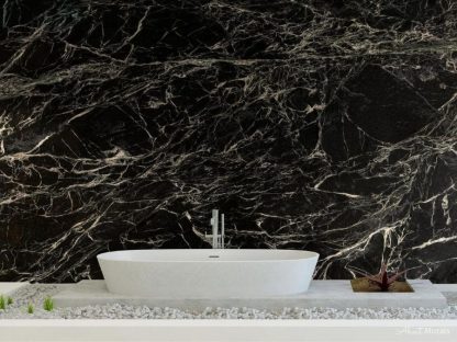Black Marble Wallpaper, as seen on the wall of this bathroom, feels sophisticated with its white veins flowing through dark stone. Marble wallpaper sold by AboutMurals.ca.