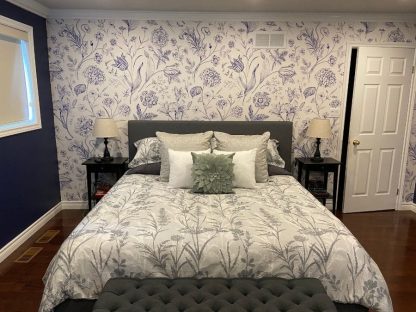 Blue Toile Wallpaper, as seen on the wall of this bedroom, is a floral mural with hydrangea, tulip, peony, lily and carnation flowers with butterflies from About Murals.