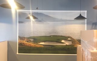 Pebble Beach Wallpaper, as seen on the wall of The Links Golf & Sports Academy in Stoney Creek, is a mural of hole 7 at the famous golf course from About Murals.
