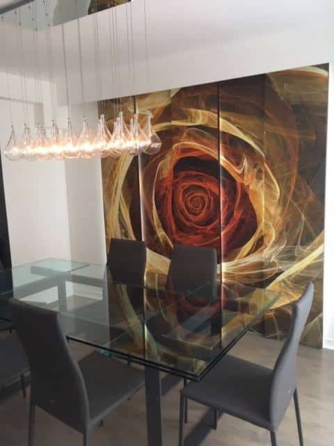 Yellow Fractal Flower Wallpaper, as seen on the wall of this dining room, features a modern yellow rose on a dark background from About Murals.