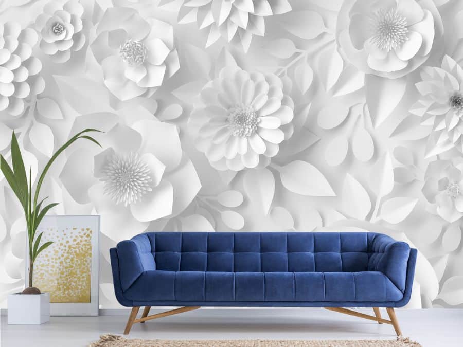 Paper Flower Wallpaper, as seen on the wall of this blue living room, is a floral mural with white, 3D looking flowers from About Murals.