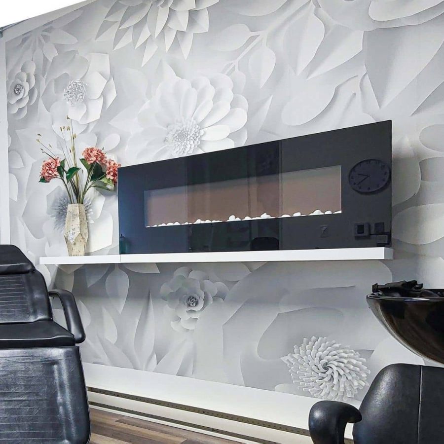 Paper Flower Wallpaper, as seen on the wall of this hair salon, is a white flower wallpaper from About Murals.