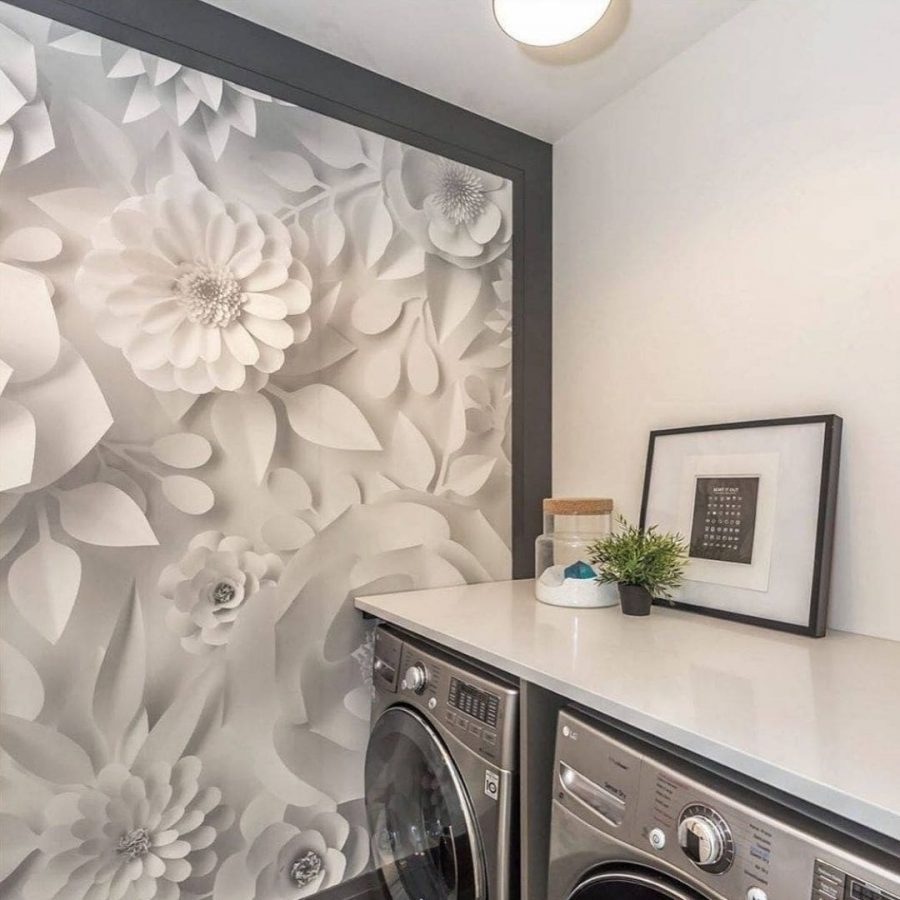 Paper Flower Wallpaper, as seen on the wall of this laundry room, features white dahlia, gerbera and rose flowers from About Murals.