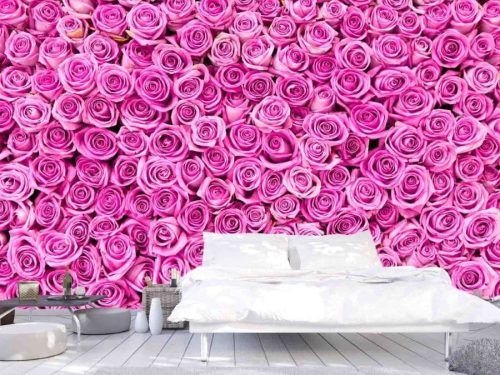 Pink Rose Wallpaper, as seen on the wall of this bedroom, features a wall full of bright pink roses from About Murals.