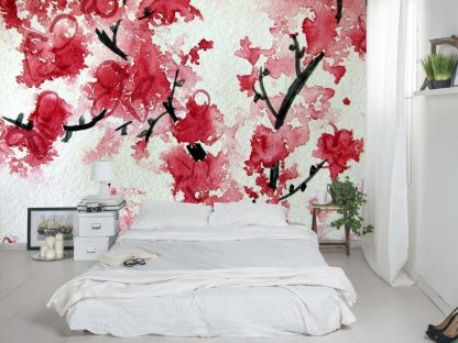 Cherry Blossom Art Wallpaper, as seen on the wall of this bedroom, features red and pink watercolor flowers on a white background from About Murals.