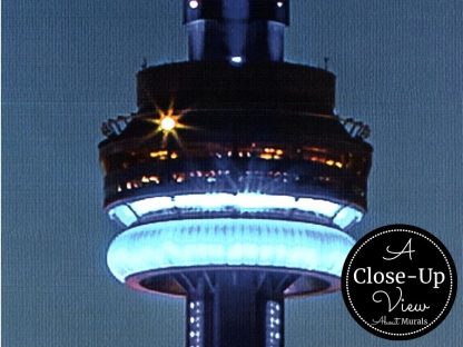 A close-up view of a Toronto Skyline Wallpaper featuring the CN Tower against a dark blue sky at night from About Murals.