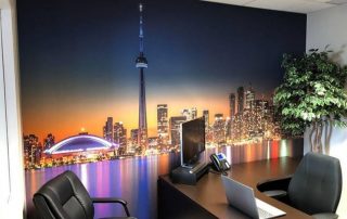 Toronto Skyline Wallpaper, as seen on the wall of this traditional office, is a cityscape mural with the SkyDome, CN Tower and buildings over Lake Ontario at night from About Murals.