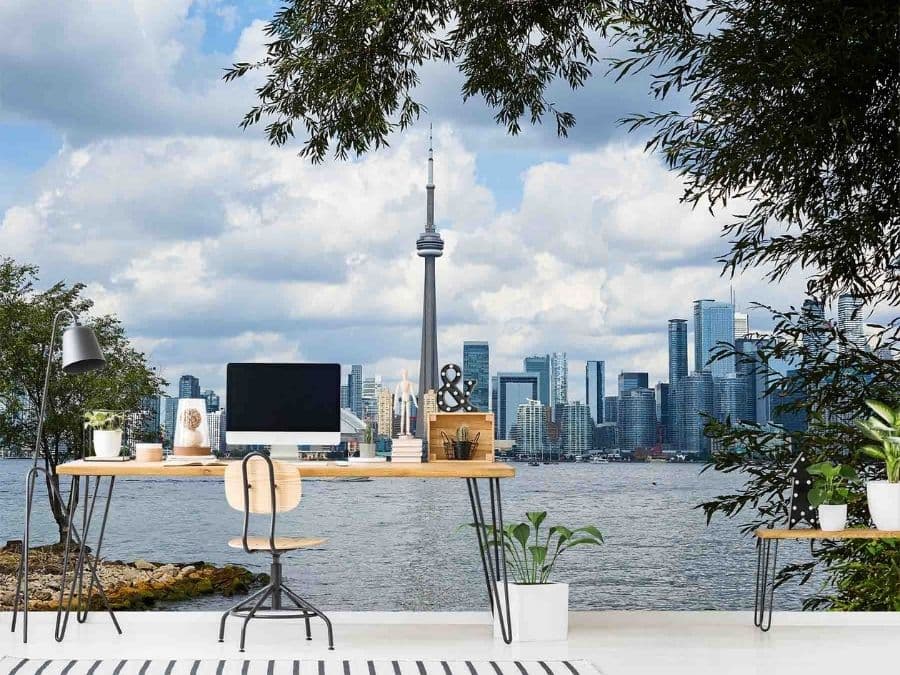 Toronto Wallpaper, as seen on the wall of this office, features skyline views of skyscrapers like the CN Tower and Rogers Centre (formerly the SkyDome) overlooking Lake Ontario from About Murals.