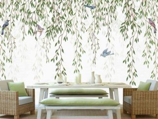 Willow Wallpaper, as seen on the wall of this dining room, features blue birds in green hanging leaves on a white background from About Murals.