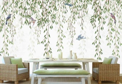 Willow Wallpaper, as seen on the wall of this dining room, features blue birds in green hanging leaves on a white background from About Murals.