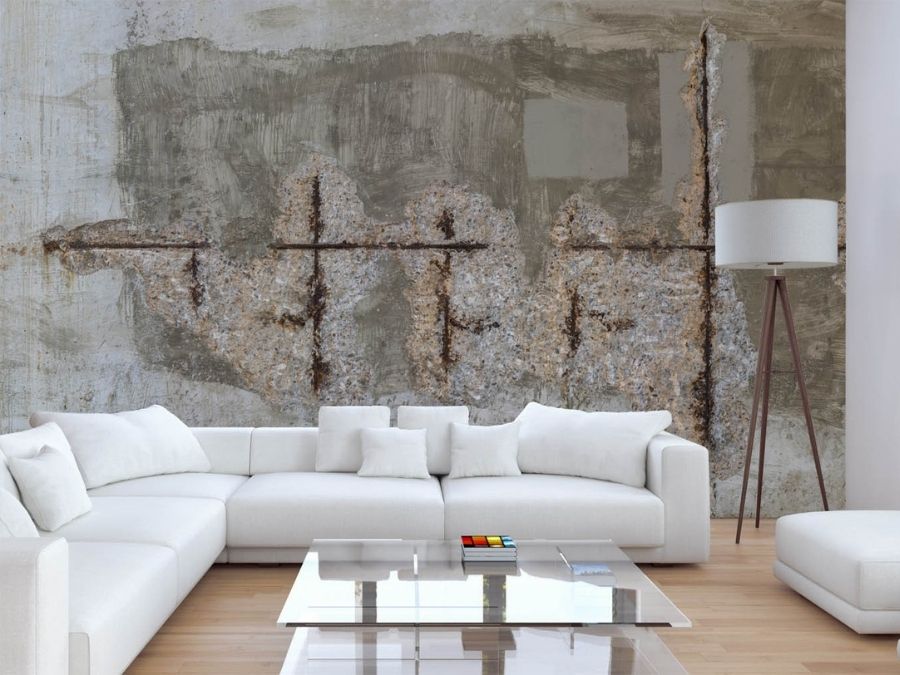 Aged Concrete Wallpaper, as seen on the wall of this bedroom, features rusted rebar rods in an old concrete wall from About Murals.
