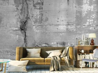 Cracked Concrete Wallpaper, as seen on the wall of this grey and yellow living room, is a realistic, distressed design from About Murals.