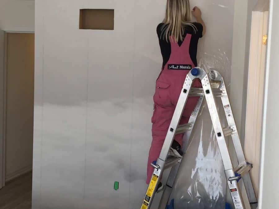 Adrienne of About Murals installs a misty mountain wallpaper for a bedroom makeover on Cityline