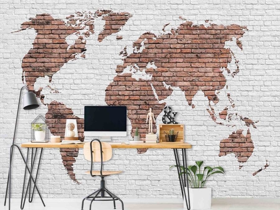 Brick World Map Wallpaper, as seen on the wall of this office, features a brown map mural on white bricks from About Murals.