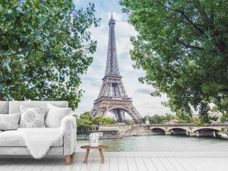Eiffel Tower Wallpaper, as seen on the wall of this living room, features the famous lattice tower overlooking the Pont D'Iena and La Seine in Paris, France from About Murals.
