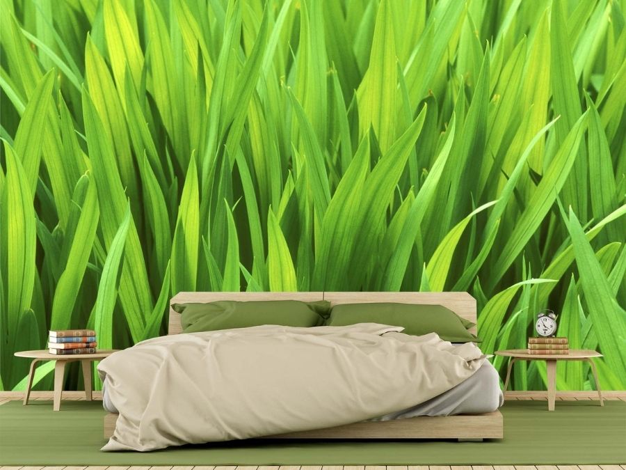 Grass Wall Wallpaper, as seen on the wall of this bedroom, is a photo mural of textured, large blades of green grass from About Murals.