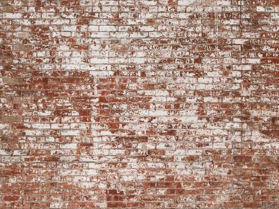 Grunge Brick Wallpaper is a textured looking red brick wallpaper with white distressed paint sold by About Murals.