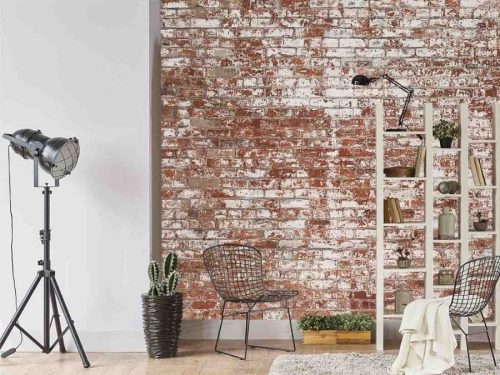Grunge Brick Wallpaper, as seen on the wall of this loft, is a realistic red brick wallpaper with white decaying paint from About Murals.