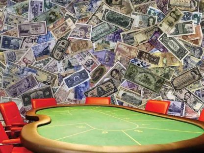 Money Wallpaper, as seen on the wall of this poker room, is a photo mural of a scattered banknote collection from around the world from About Murals.