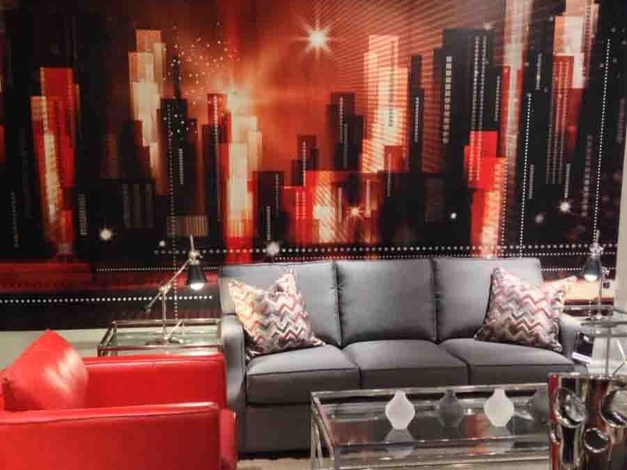 Red and Black City Wallpaper, as seen on the wall of this living room, is a wall mural with buildings and skyscrapers against a red sky from About Murals.